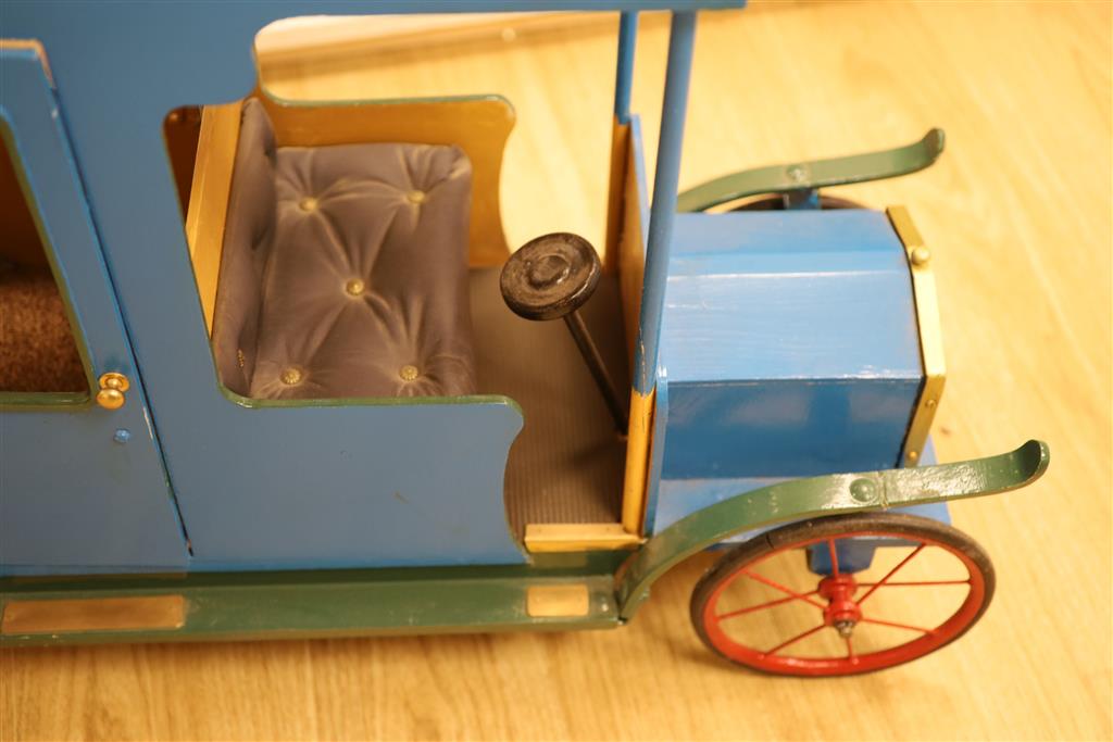 A novelty early 20th century model car, width 108cm height 62cm